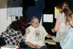 Hack Herer autographing his book The Emperor Wears No Clothes